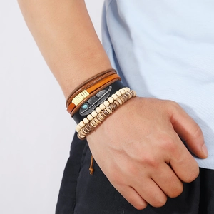 Retro multi-layer leather bracelet set with wooden beads and turquoise feather charm