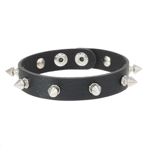 Detail of black leather punk bracelet with silver metal spikes and snap button closure