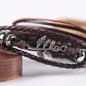 Handmade multilayer leather bracelet featuring vintage maple leaf and braided rope