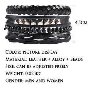Detail of multi-layer leather bracelet with metal pyramid studs and black beads