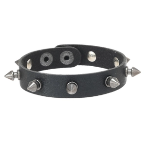 Detail of black punk leather bracelet featuring five sharp silver metal cone studs
