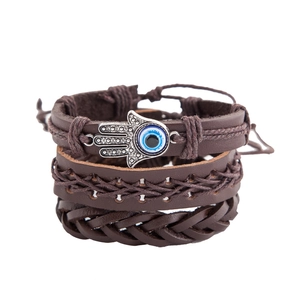 Three-piece set of brown leather braided bracelets with Hamsa Hand and Evil Eye charms