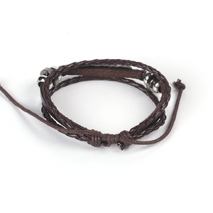 Detail view of multilayer woven leather bracelet with silver beads and adjustable knot