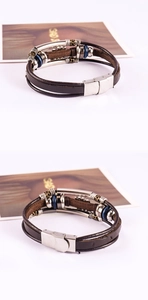 Macro view of vintage leather bracelet showing multi-layer beads and silver metal clasp