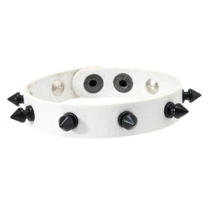 Detail of white punk leather bracelet with black cone studs and silver snap fasteners