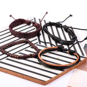 Four-piece set of vintage leather punk bracelets with braided ropes and wooden beads