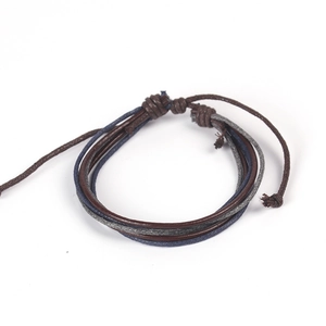 Detail of multi-layer braided leather bracelet with adjustable slide knot and wooden beads