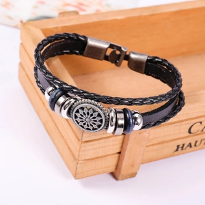 Vintage multilayer black leather sunburst charm bracelet with blue beads and woven cords