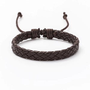 Close-up of dark brown braided leather bracelet with adjustable slide knot and cord ends