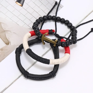 Three-piece nautical leather bracelet set with bronze anchor pendant and viking theme