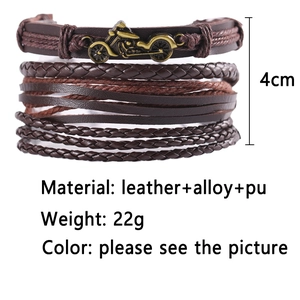 Detail view of multilayer leather bracelet with bronze motorcycle alloy charm and weaving