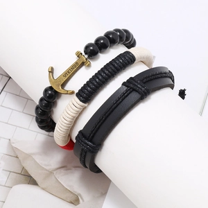 Three-piece nautical leather bracelet set with woven ropes and bronze anchor pendant