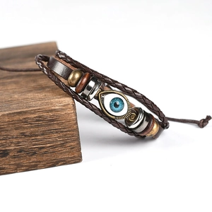 Retro multi-layer brown leather bracelet featuring blue evil eye and bronze beads