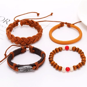 Multilayer leather bracelet set with alloy leaf charm and wooden beads on white background