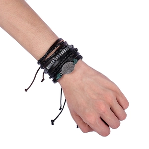 Vintage multilayer leather bracelet featuring woven ropes, beads and metal leaf charm