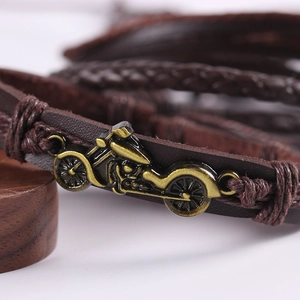 Retro multi-layer woven leather bracelet featuring a bronze motorcycle charm in punk style