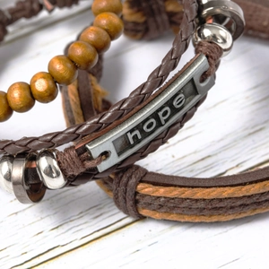 Three-piece set of vintage leather braided bracelets featuring wood beads and Hope metal charm