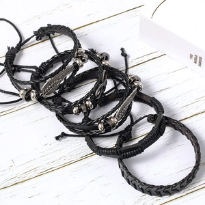 6-piece black leather woven bracelet set with wing and infinity charms in punk style