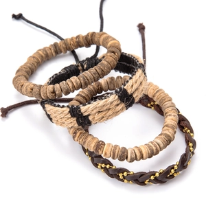 Detail of bohemian multilayer bracelet set with wood beads, hemp rope and leather cord