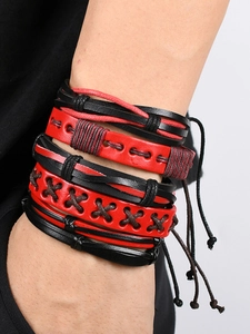 Detail of red and black multi-layer braided leather bracelet with adjustable cords