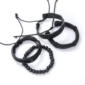 Set of four black braided leather and beaded bracelets for men with adjustable cords