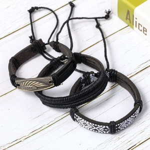 Three-piece black leather and braided rope bracelet set with vintage feather metal charm