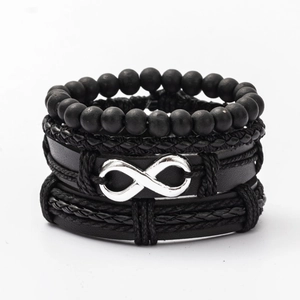 Detail of multi-layer men's black leather bracelet set with infinity symbol charm