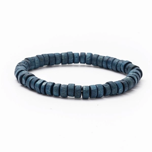 Macro view of blue natural texture beads and elastic cord detail of a vintage bracelet