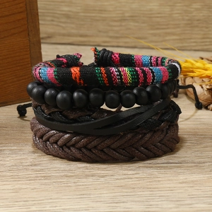 Set of 4 bohemian bracelets featuring colorful beads and vintage woven leather patterns