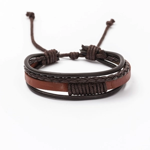 Detail of multi-layer braided leather bracelet with dark brown cords and adjustable knot