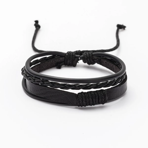 Close-up of black multilayer leather bracelet with braided rope and adjustable cord