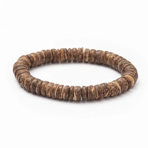 Macro detail of Bohemian handmade braided bracelet showing wood texture and rustic beads