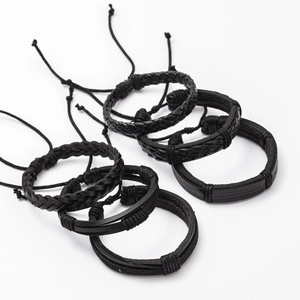 Detailed view of 6-piece black braided leather bracelets with adjustable sliding knots