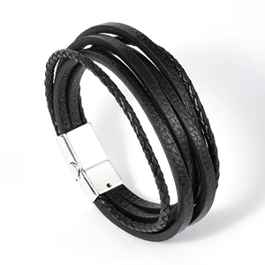 Men's multilayer black braided leather bracelet with silver magnetic buckle on white background