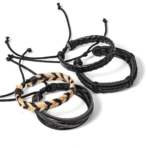 Men's minimalist braided leather bracelet set with four adjustable rope styles on white