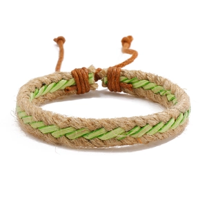 Handmade ethnic woven hemp rope bracelet with adjustable green and white cord detail