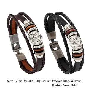 Detail showing multi-layer vintage leather bracelets with sun and moon alloy charms