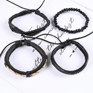 Four-piece men's vintage black braided leather bracelet set with beads and woven details