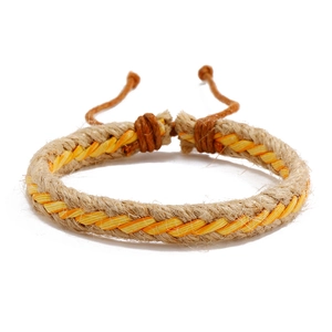 Close-up of handmade braided hemp bracelet with adjustable slip knot in orange and tan