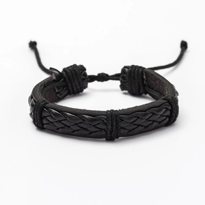 Close-up of black braided leather bracelet with adjustable cord knot on white background