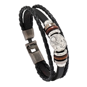 Men's multilayer woven leather bracelet featuring celestial sun moon and star metal charms