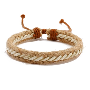 Close-up of handmade braided hemp rope bracelet with spiral texture and adjustable knot