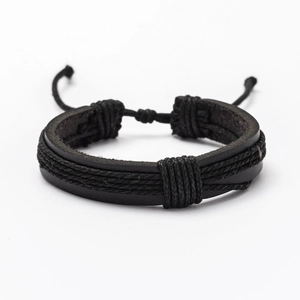 Detail of multi-strand black woven leather bracelet with adjustable pull-string knot