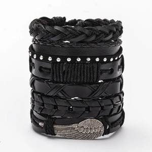 Close-up of multilayer men's leather bracelets featuring a silver feather charm and studs