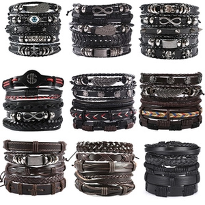 Nine sets of multi-layer braided leather bracelets with turquoise and vintage metal charms
