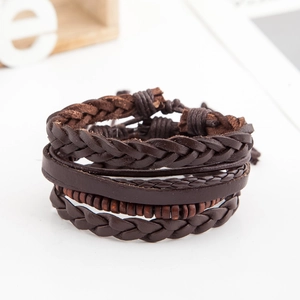 Detail of multi-layer leather braided bracelet with round wooden beads and cords