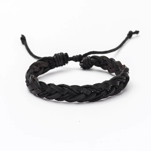 Close-up of black braided leather bracelet featuring adjustable sliding knot closure