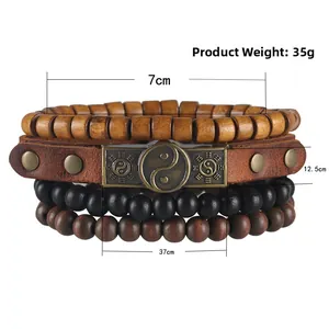 Detail view of multi-layer leather bracelets with Yin Yang metal plate and wood beads