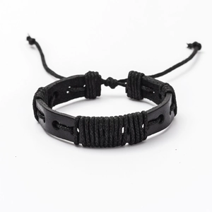 Detail of adjustable black woven leather bracelet with handmade rope knot design