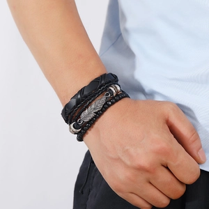 Men's retro multilayer leather bracelet set with silver feather pendant on wrist